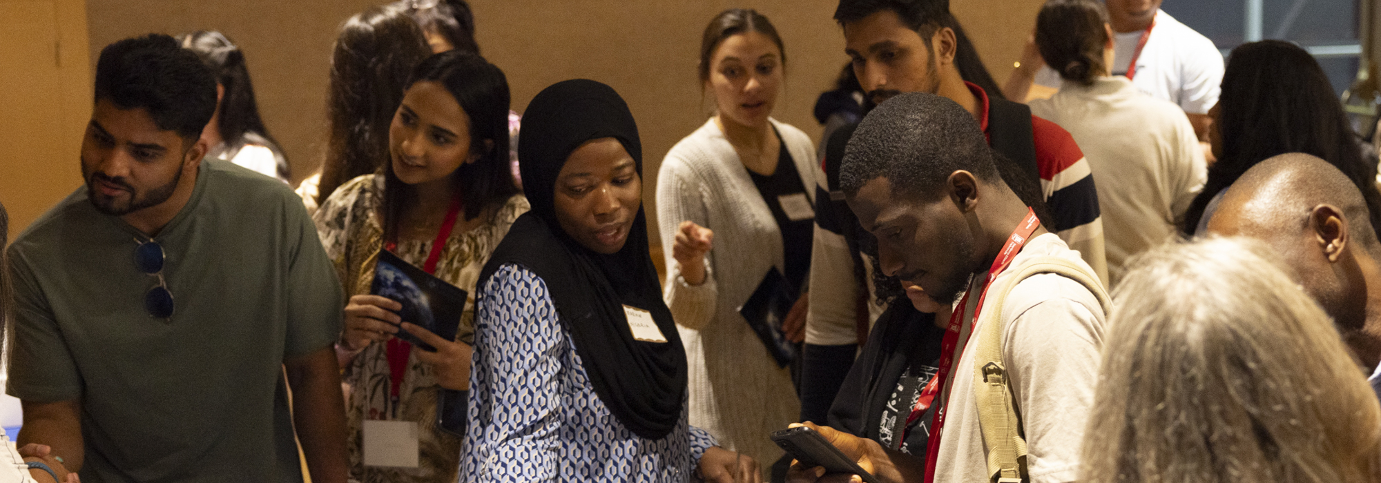 Group of students at a job fair talking to each other